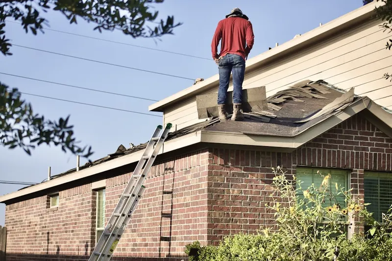 Professional roofer working on a residential roof in Rancho Ramon